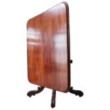 A 19TH CENTURY MAHOGANY TILT-TOP BREAKFAST TABLE, a moulded oblong top on a turned pedestal base