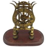 A 19TH CENTURY BRASS FUSEE SKELETON CLOCK, 11 cm dial with Roman numerals, the scrolling plates