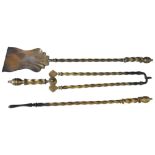 A SET OF THREE EARLY 19TH CENTURY BRASS FIRE IRONS, with spiral twist shafts, along with a wrought-