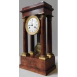 A 19TH CENTURY FRENCH WALNUT PORTICO CLOCK, enamel dial with a laurel decorated gilt metal surround,