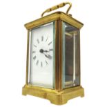 A SWISS MADE BRASS CARRIAGE CLOCK, in working order, 15 x 8 x 6.5 cm