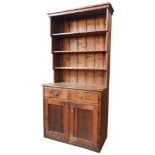 AN IRISH 19TH CENTURY PINE KITCHEN DRESSER, single piece construction with three tier plate rack