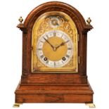 AN OAK BRACKET CLOCK, brass dial with silvered chapter ring, Roman & Arabic numerals with subsidiary