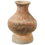 A CHINESE EARTHENWARE VASE NEOLITHIC PERIOD the sides with traces of painted decoration 32cm high