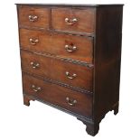 A GEORGE III MAHOGANY CHEST OF DRAWERS, two short drawers over three long drawers, raised on bracket