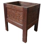 A 19TH CENTURY CARVED OAK PLANTER, simplistic form, with scroll foliate and roundel carved panels,