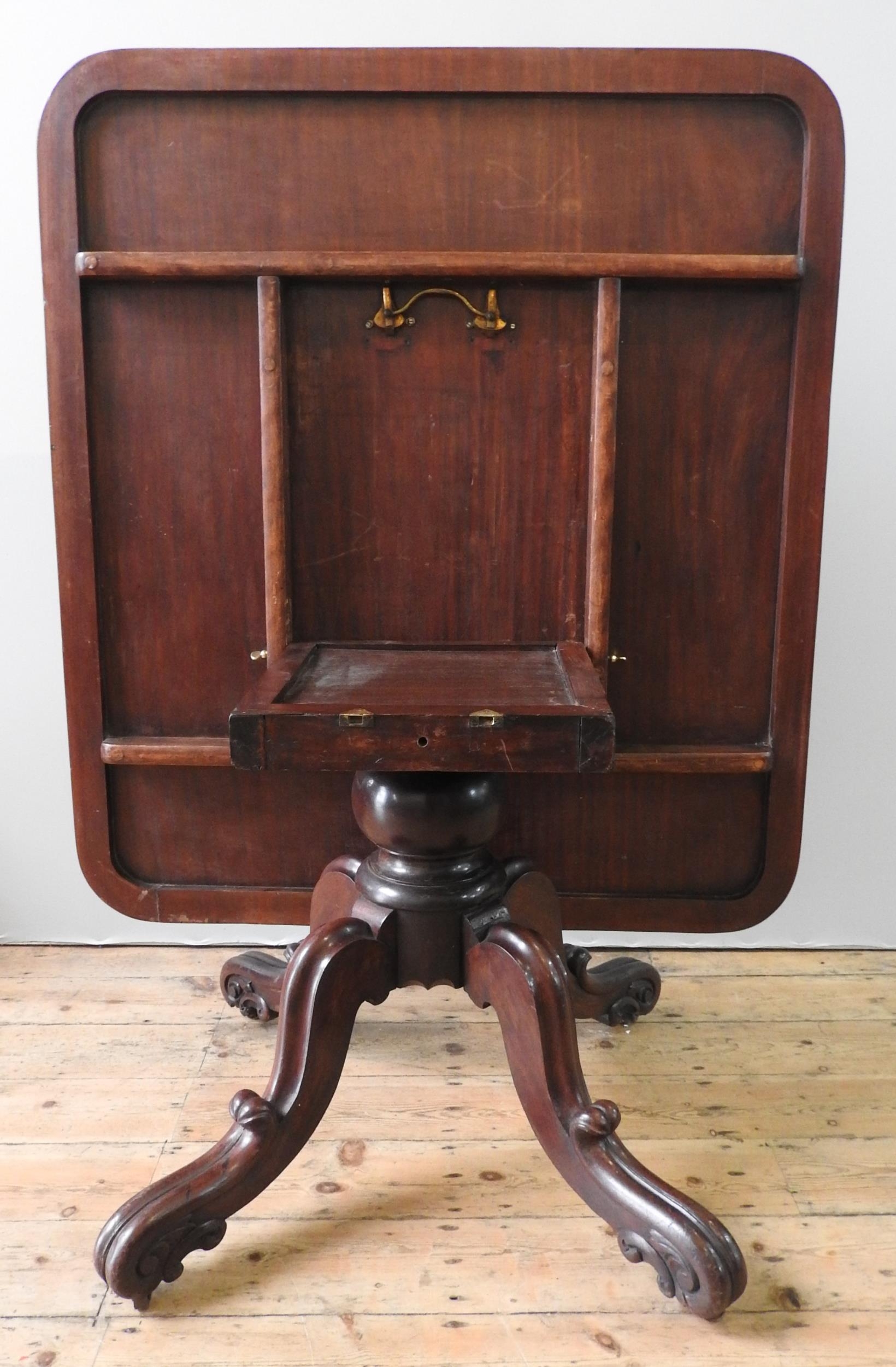 A 19TH CENTURY MAHOGANY TILT-TOP BREAKFAST TABLE, a moulded oblong top on a turned pedestal base - Image 2 of 2