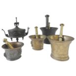 FOUR 18TH / 19TH CENTURY BRONZE MORTARS WITH PESTLES AND A COVERED CAST METAL POT ON STAND, the