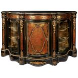 A FINE NAPOLEON III EBONISED BRASS & TORTOISESHELL INLAID CREDENZA, a serpentine top with