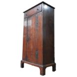 A LATE 18TH / EARLY 19TH CENTURY FRUIT WOOD MUSIC CUPBOARD, long frieze drawer above cupboard