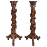 IMPRESSIVE PAIR OF DRAGON-CARVED HUANGHUALI STANDS QING DYNASTY, 19TH CENTURY the circular