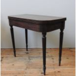 A GEORGE III MAHOGANY TEA TABLE, with fold over top, string inlaid frieze detailing, raised on