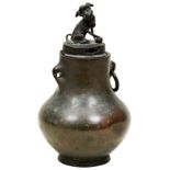 BRONZE BALUSTER VASE 18TH / 19TH CENTURY with an associated cover surmounted by a Buddhist lion 15cm