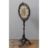 A VINTAGE POLE SCREEN, inset with circular needlepoint panel depicting bird amongst foliage, the