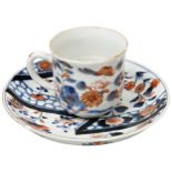 EXPORT IMARI CUP AND SAUCER 18TH CENTURY decorated in the typical palette blossoming plants and a