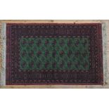 A CONTEMPORARY BOKHARA RUG, the central panel decorated with three rows of nine gulls, on a