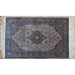 A SMALL PERSIAN PART SILK RUG, floral decoration on a cream ground 128 x 82 cm