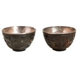 PAIR OF CARVED COCONUT AND SILVER LINED WINE CUPS KANGXI PERIOD (1662-1722) the sides carved in