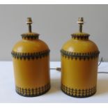 PAIR OF OKA 'BERBER' TABLE LAMPS, cannister form, painted pale gold with border patterns, 45 cm high