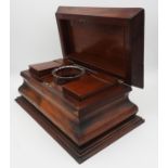 A LARGE MAHOGANY FANCY SARCOPHAGUS SHAPED TEA CADDY, circa 1820, the interior with two slot in