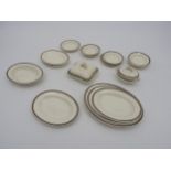 A COLLECTION OF VINTAGE MINIATURE DINNER WARE, cream glazed with concentric border pattern,
