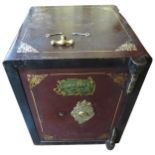A LATE 19TH CENTURY CAST-IRON SAFE, by George Price Ltd of Wolverhampton, with ornate brass key