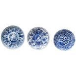 THREE BLUE AND WHITE SAUCER DISHES QING DYNASTY, 18TH CENTURY each painted in tones of underglaze