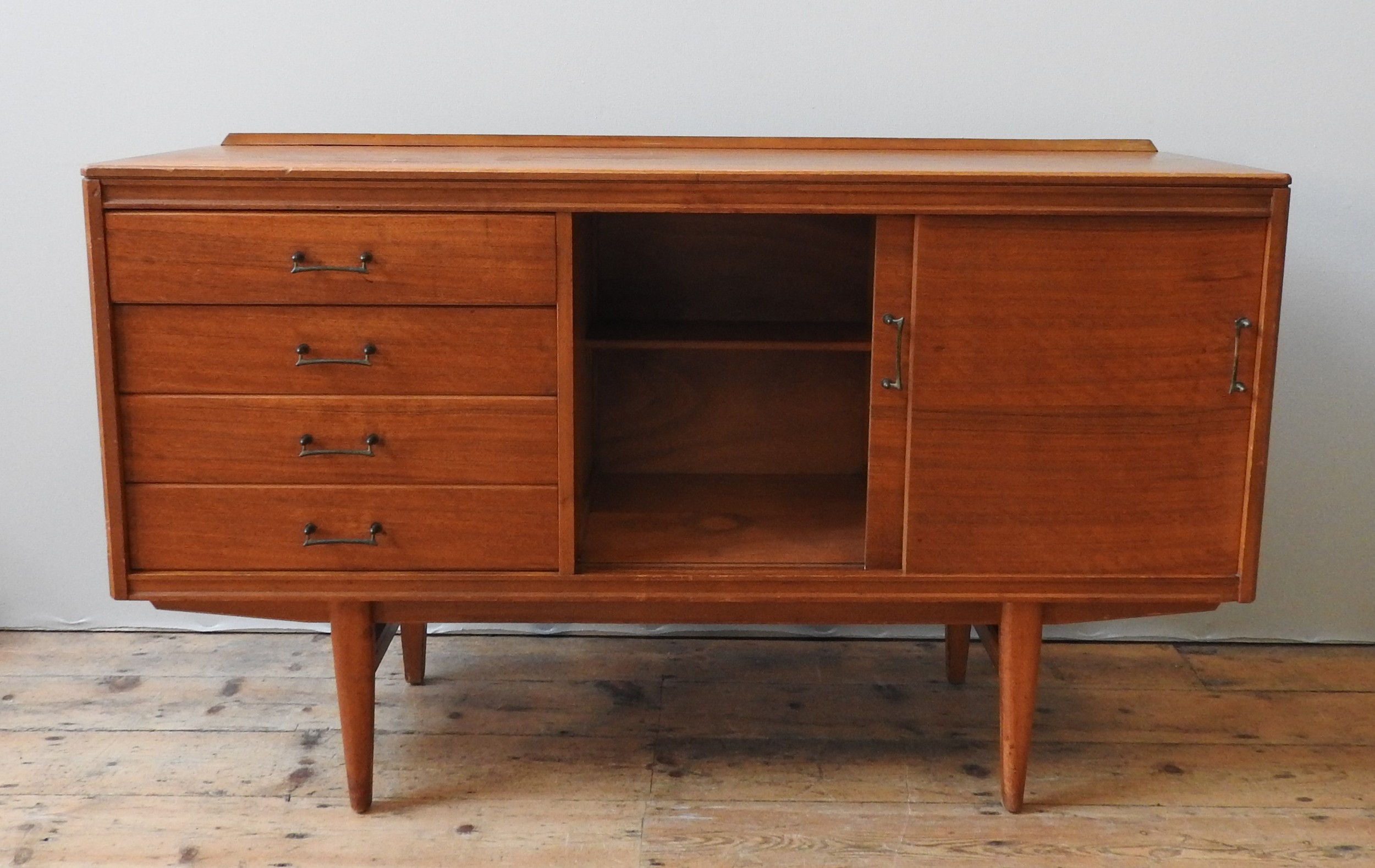 A TEAK MID CENTURY SIDEBOARD, circa 1960, four short drawers beside two sliding doors, enclosing two - Image 3 of 4