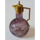 A LATE 19TH CENTURY CLARET JUG BY STEVENS & WILLIAMS, amethyst tinged glass, the globular body and