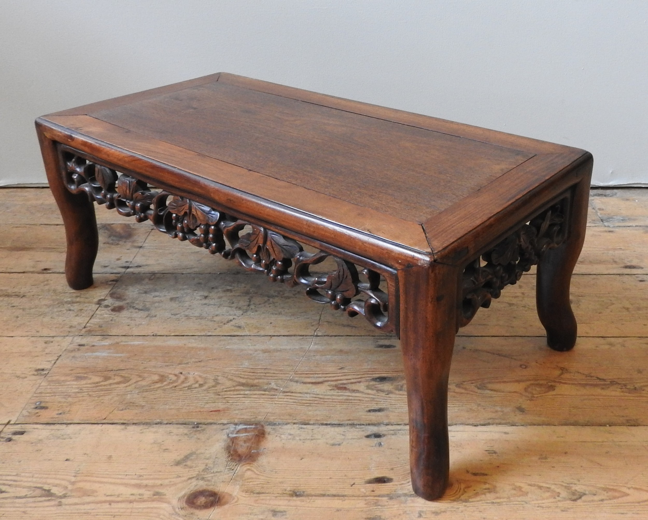 A CHINESE HONG MU KANG TABLE, Qing dynasty, 19th century, the cleated rectangular top above a