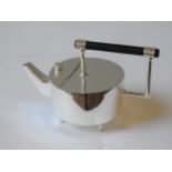 AN ELECTRO PLATED JAPANESE STYLE TEAPOT, drum-shaped body with angular spout, raised on four