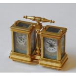 A FRENCH STYLE DOUBLE CARRIAGE CLOCK / BAROMETER, brass body inset with landscape decorated