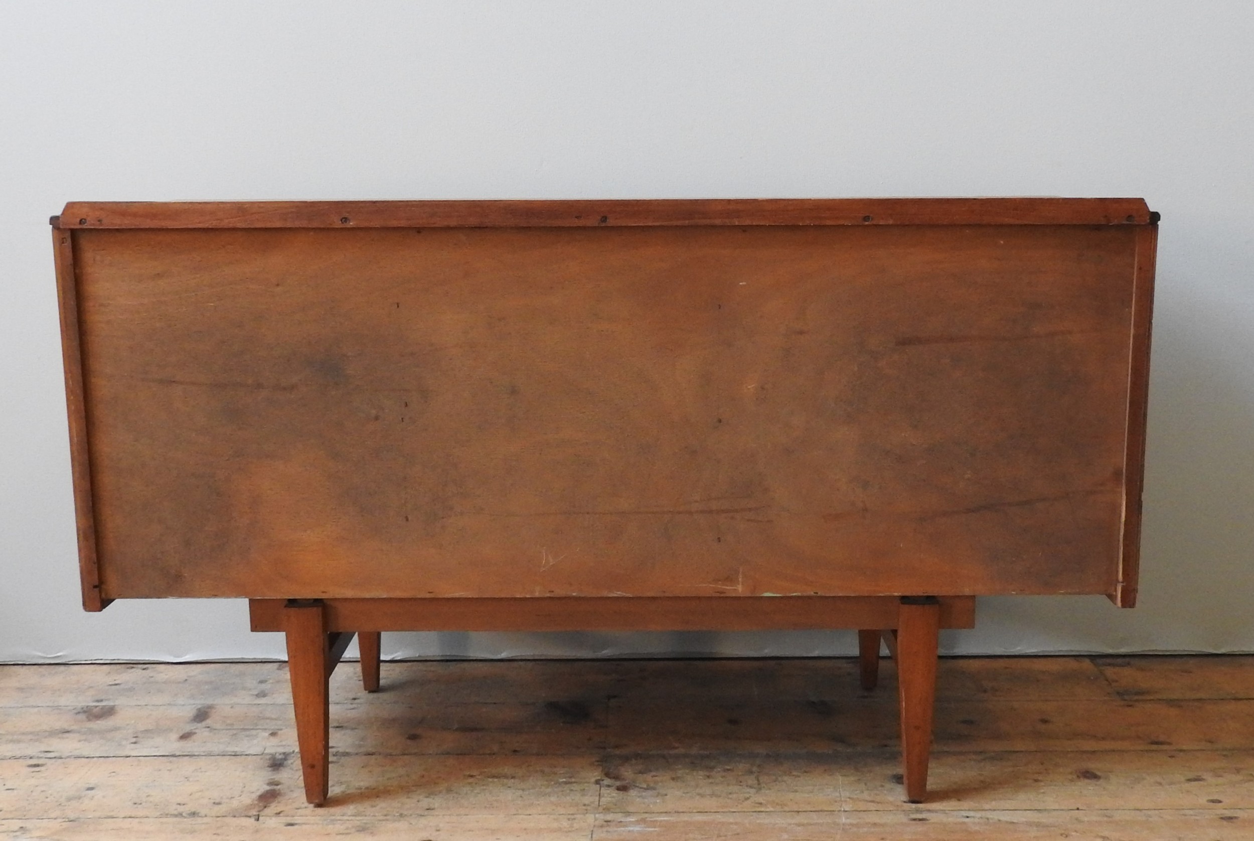 A TEAK MID CENTURY SIDEBOARD, circa 1960, four short drawers beside two sliding doors, enclosing two - Image 4 of 4