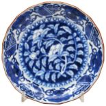 JAPANESE ARITA BLUE AND WHITE BARBED DISH EDO PERIOD, 18TH CENTURY painted with peonies, Buddhist