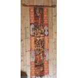 AN INDONESIAN IKAT WALL HANGING, 20th century, border decorated with grotesque figures, central Ikat