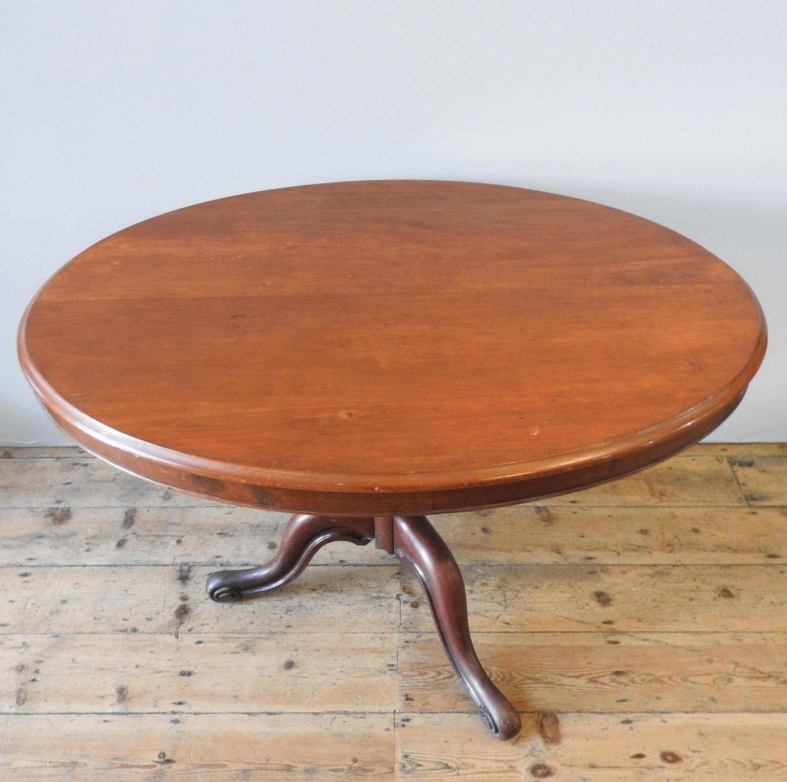 A 19TH CENTURY MAHOGANY LOO TABLE, tilting oval top on a turned baluster base on three down swept - Image 4 of 4