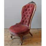 A 19TH CENTURY WALNUT NURSING CHAIR,  the walnut frame with scroll cartouche detail to the top,