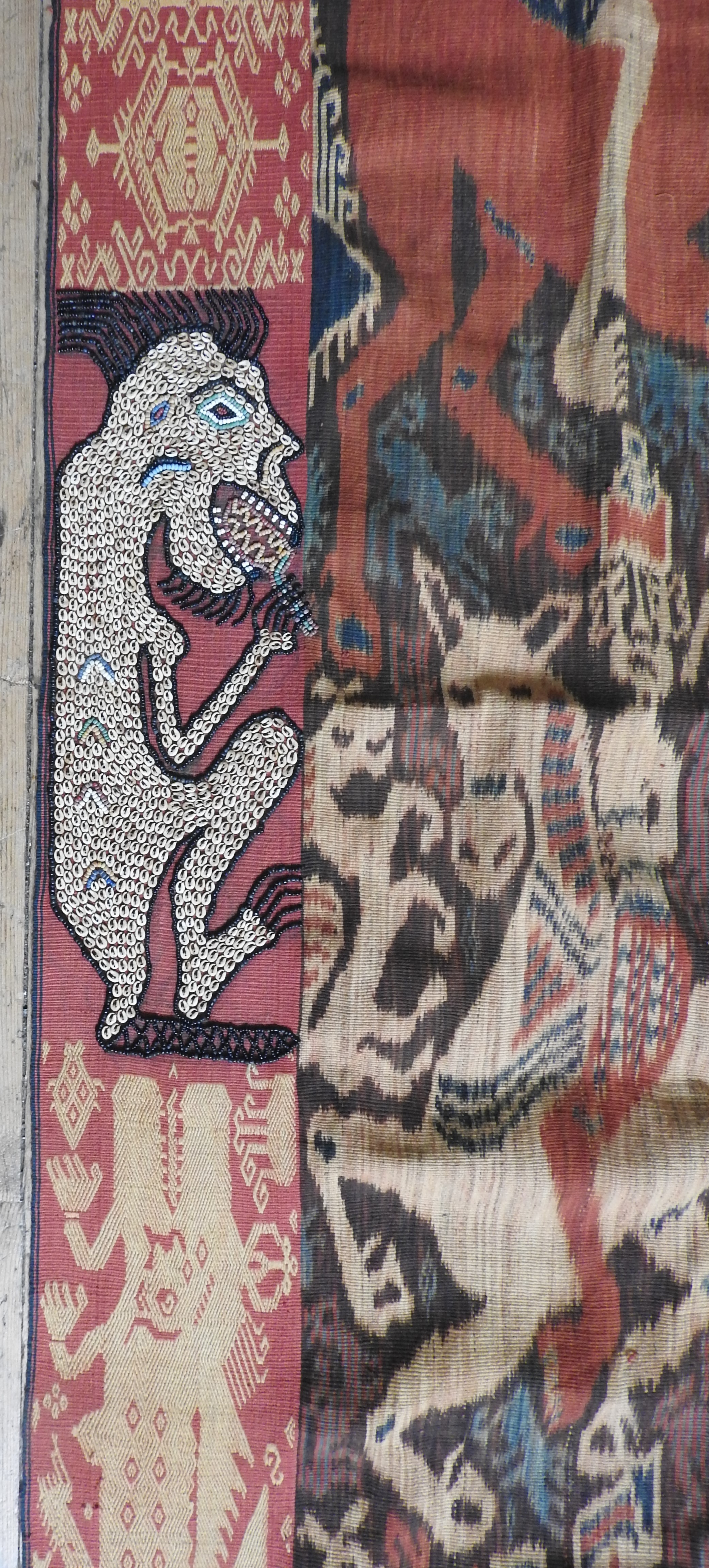 AN INDONESIAN IKAT WALL HANGING, 20th century, border decorated with grotesque figures, central Ikat - Image 3 of 3