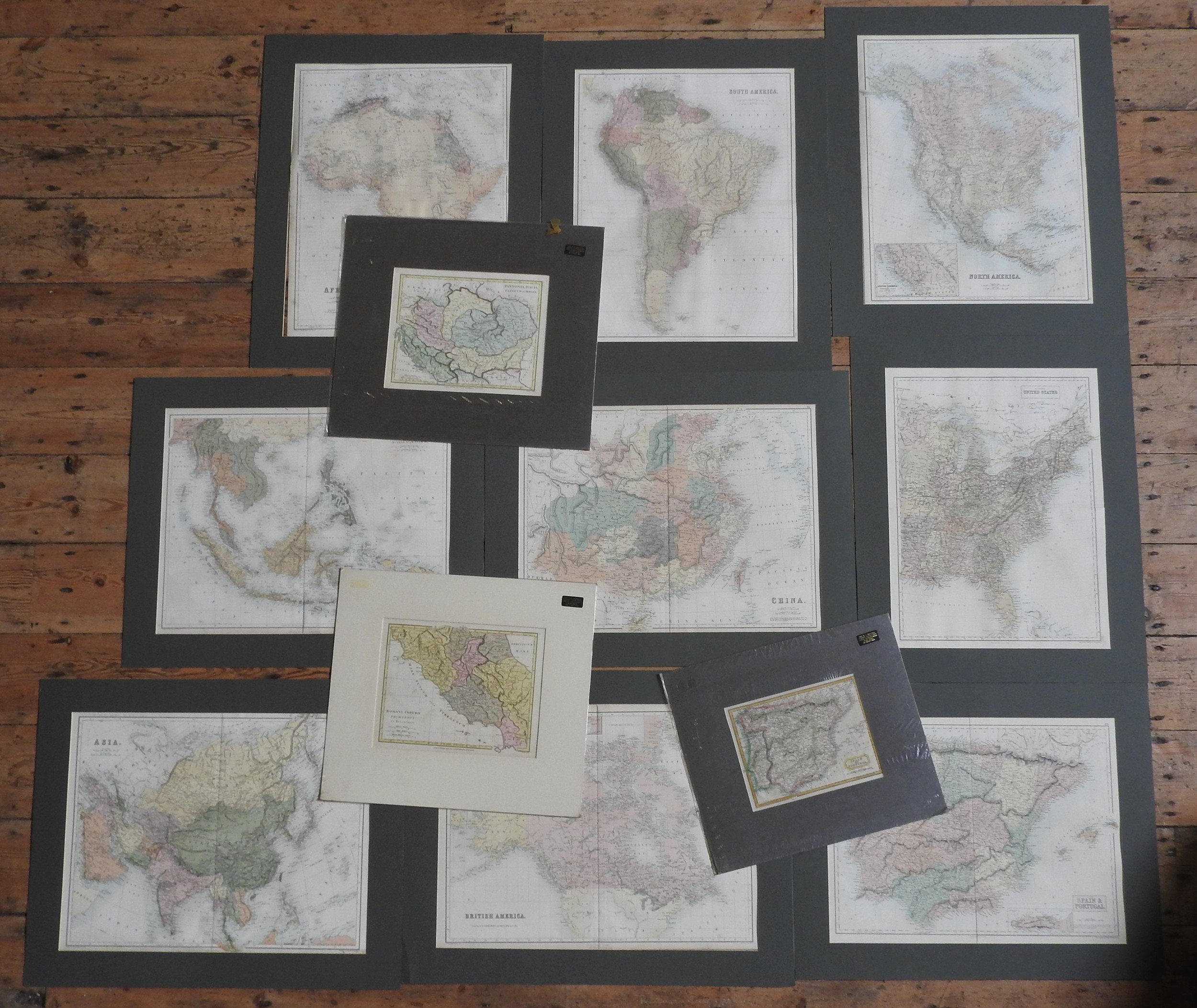 A FOLIO OF TWENTY FOUR ANTIQUE MAPS, hand coloured, various locations, countries and sizes