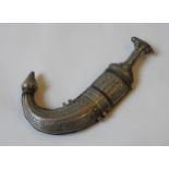 AN OMANI SAIDI KHANJAR, curved blade with ornate silvered handle and case, 33 cm long