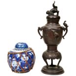 A CHINESE BRONZE INCENSE BURNER AND A GINGER JAR, the incense burner of baluster form with two