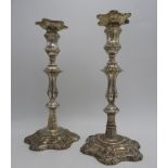 A PAIR OF SILVER , with knopped fluted pillars on stepped scroll work hexagonal bases