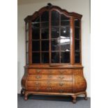 AN EARLY 19TH CENTURY DUTCH WALNUT MARQUETRY VETRINE, two astragal glazed enclosing three shelves