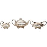 A REGENCY SILVER THREE PIECE TEA SERVICE, fluted baluster form with ornate floral repousse