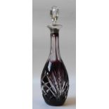 AN AMETHYST GLASS DECANTER, elegant slender form with cut glass decoration and silver collar