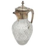 A SILVER MOUNTED GLASS CLARET JUG, tapered baluster form with faceted and cut glass decoration,