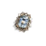 AN AQUAMARINE AND DIAMOND RING the emerald cut, cut corner claw set aquamarine, surrounded by 14,