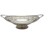 A PIERCED SILVER OVAL BASKET, hand cut pierced decoration with Grecian urn and laurel garland