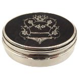 A SILVER & TORTOISESHELL PILL BOX, of oval form, the tortoiseshell inset lid decorated with