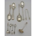 TWO VICTORIAN SILVER SERVING SPOONS, circa 1850, along with a pair of silver rat tail salad servers,